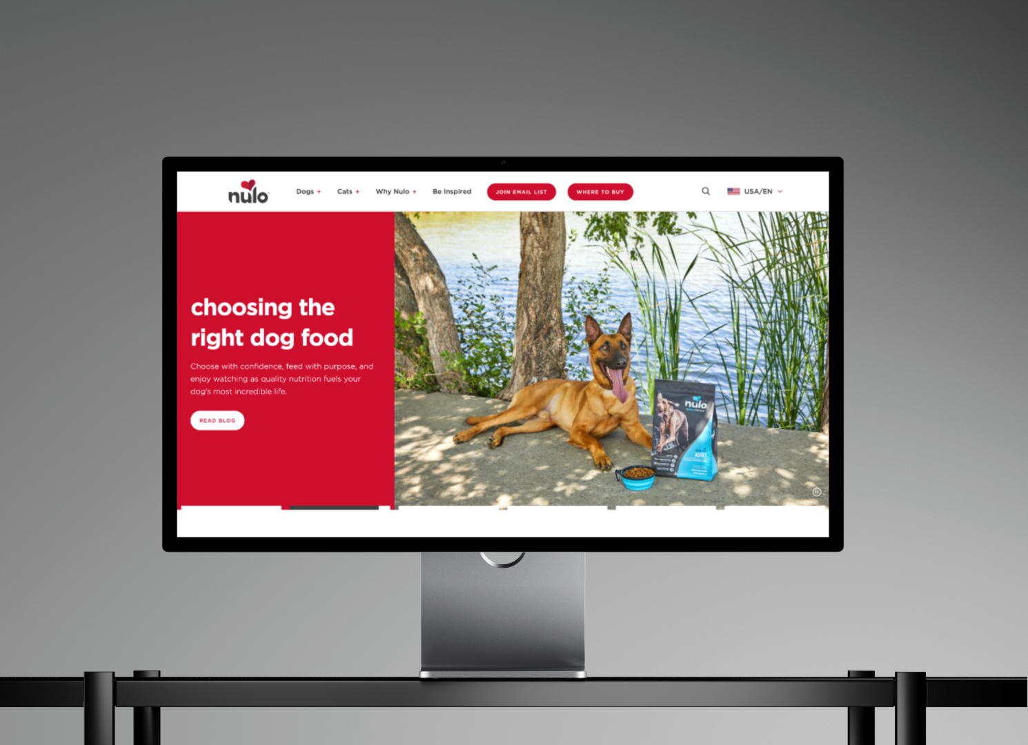 Nulo Pet Food homepage displayed on a desktop monitor featuring high-protein dog food and a Belgian Malinois.